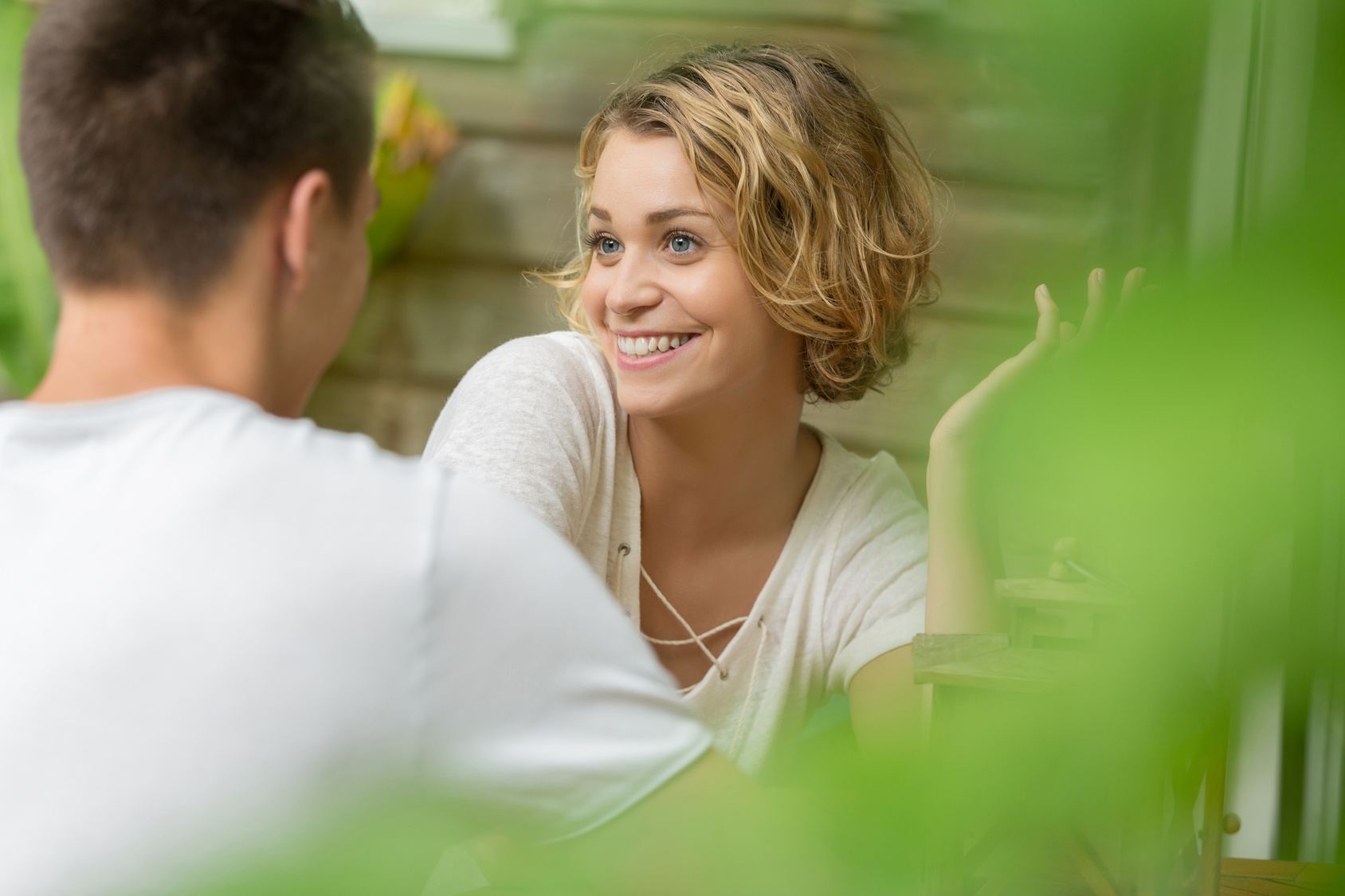 A couple enjoying a close conversation outdoors